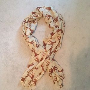 Tan scarf with light brown giraffes